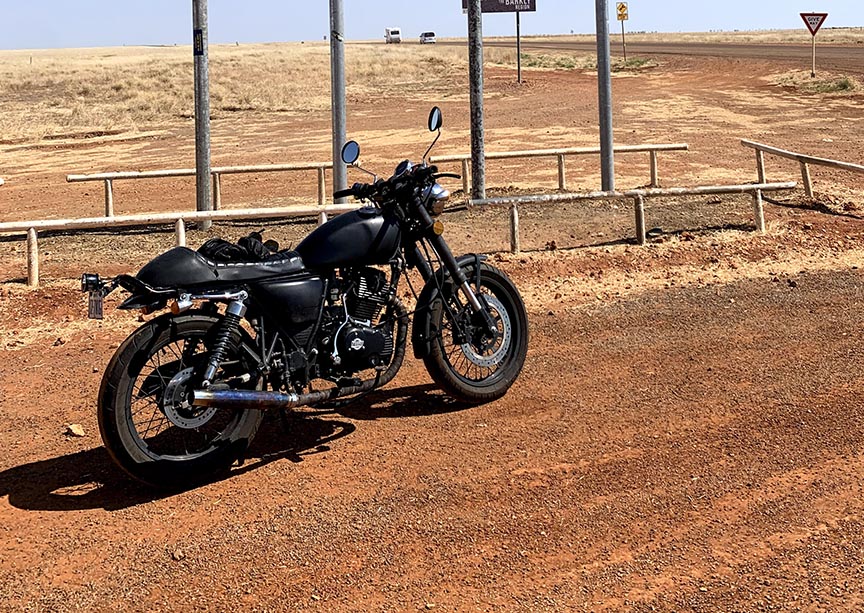 A Black Motorcycle In The Australian Outback